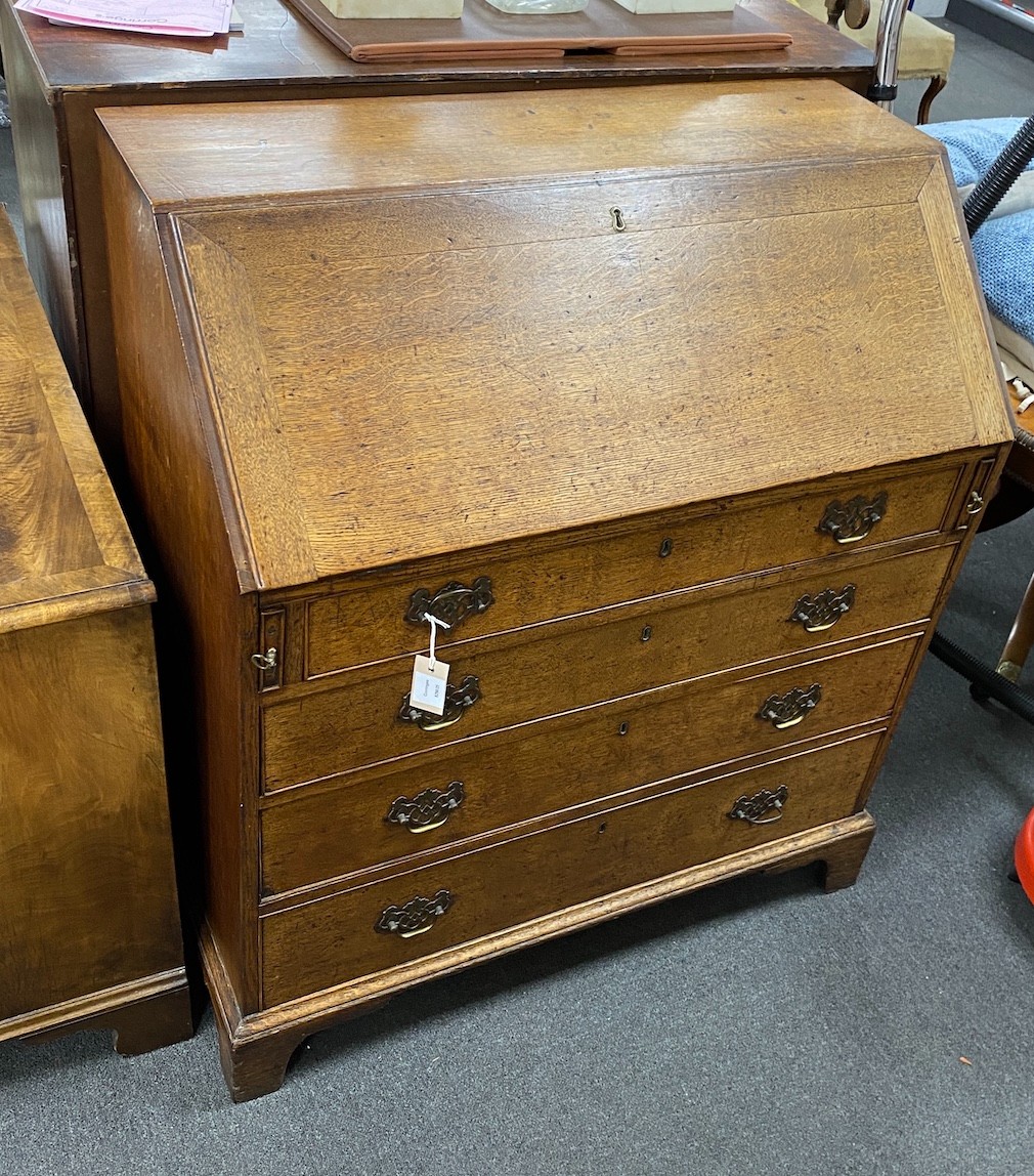 A George III oak bureau, width 92cm, depth 48cm, height 104cm